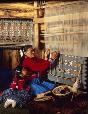 “Showing Her How.” Navajo weaver Susie Yazzie with her daughter in her hogan in Monument Valley, Arizona 